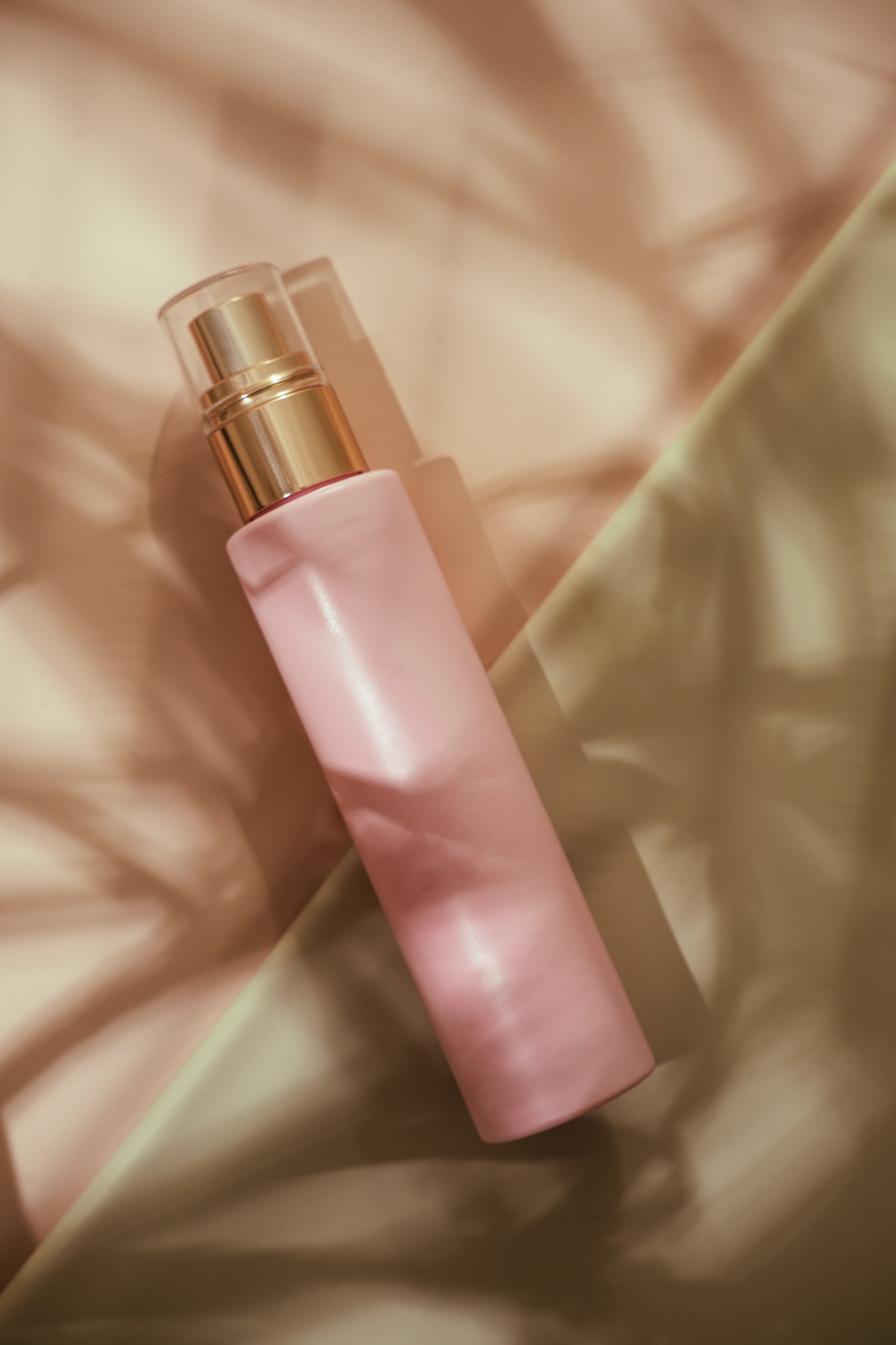 pink-cosmetic-beauty-bottle-minimalist-flatlay.jpg